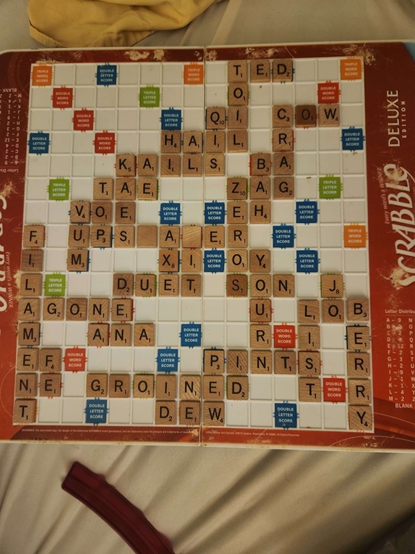 A Scrabble board containing a completed game